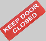 Orange acrylic sign with white text 'KEEP DOOR CLOSED'