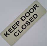 Almond acrylic sign with Black text 'KEEP DOOR CLOSED'