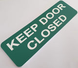 Celadon Green acrylic sign with white text 'KEEP DOOR CLOSED'