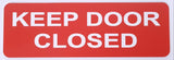 Orange acrylic sign with white text 'KEEP DOOR CLOSED'