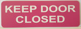 Pink acrylic sign with white text 'KEEP DOOR CLOSED'