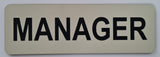 Almond acrylic sign with Black text 'MANAGER'