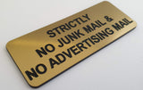 Gold acrylic sign with black engraved text 'Strictly No Junk Mail & No Advertising Mail' on a white background