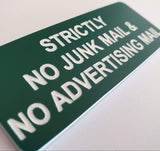 Evergreen acrylic sign with white engraved text 'Strictly No Junk Mail & No Advertising Mail' on a white background