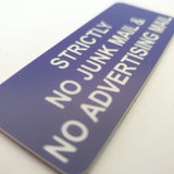 Purple acrylic sign with White engraved text