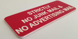 Red acrylic sign with white engraved text