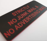 Black acrylic sign with red engraved text 'Strictly No Junk Mail & No Advertising Mail' on a white background
