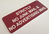 Burgundy acrylic sign with White engraved text