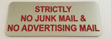 Silver acrylic sign with red engraved text 'Strictly No Junk Mail & No Advertising Mail'