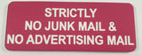 Pink acrylic sign with white engraved text 'Strictly No Junk Mail & No Advertising Mail' on a light gray background