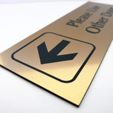 Metallic Gold acrylic sign with an arrow and text engraved in Black