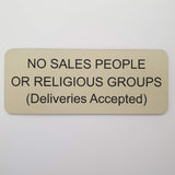 Almond acrylic sign with black engraved text on a white background