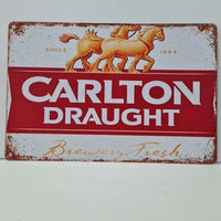 Vintage-style Carlton Draught sign with horses and red background
