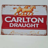 Vintage-style Carlton Draught sign with horses and red background
