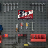 Wall-mounted tool organizer with various tools and a humorous sign on a gray pegboard background.