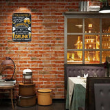 Restaurant interior with a brick wall, decorative sign, and window view.