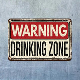 Vintage-style metal sign with 'WARNING DRINKING ZONE' text on a textured blue background