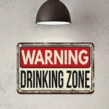 Vintage-style metal sign with 'WARNING DRINKING ZONE' text on a textured wall.