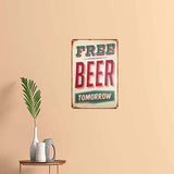 Vintage-style 'Free Beer Tomorrow' sign on a beige wall with a plant and mug on a table.